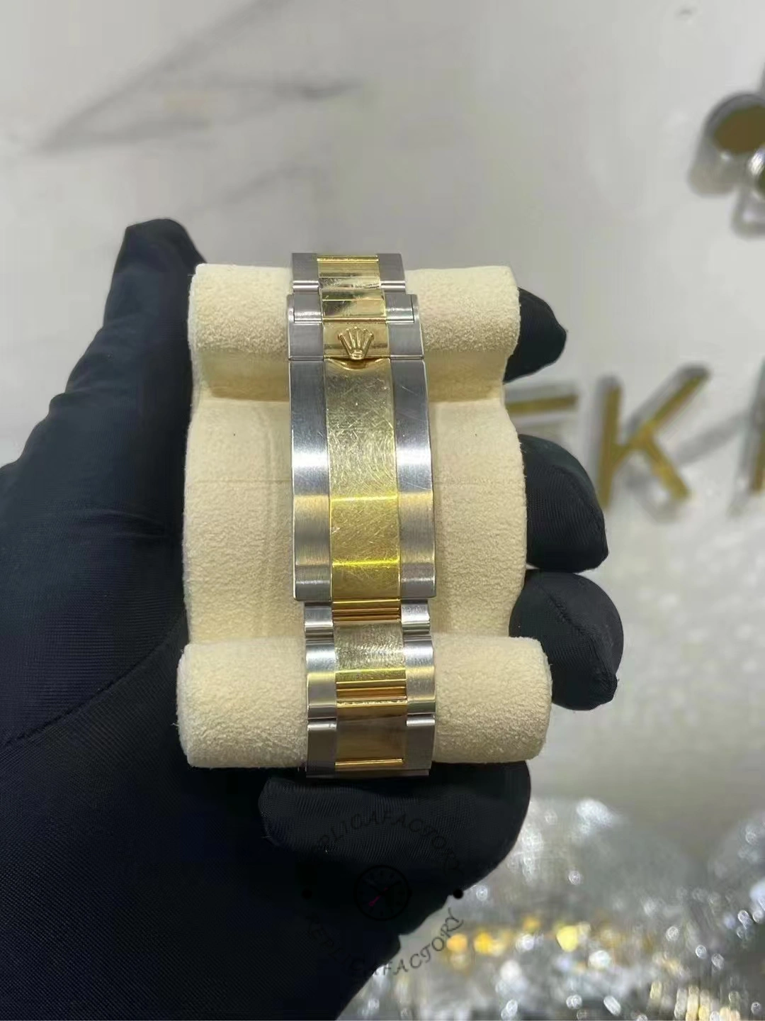 Rear bracelet view of a worn Rolex Submariner 126613LN-0002 showing the gold center links and Rolex clasp