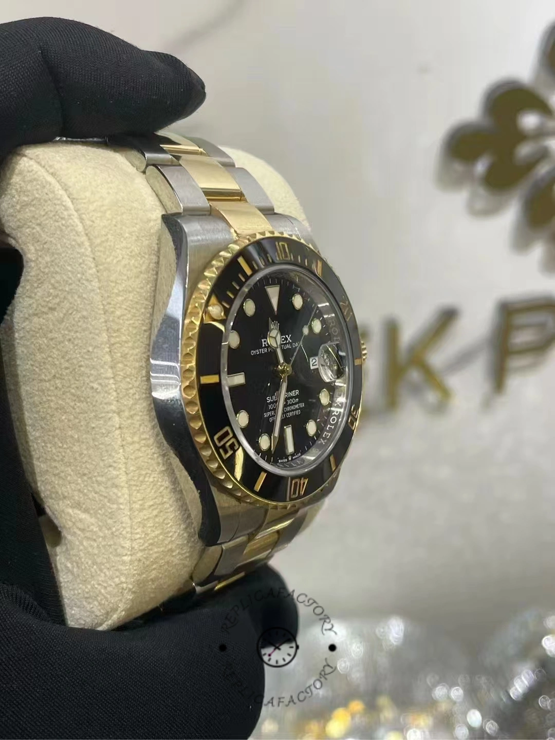 Angled side shot of a two-tone Rolex Submariner 126613LN-0002 after two years of wear, showing case and bracelet