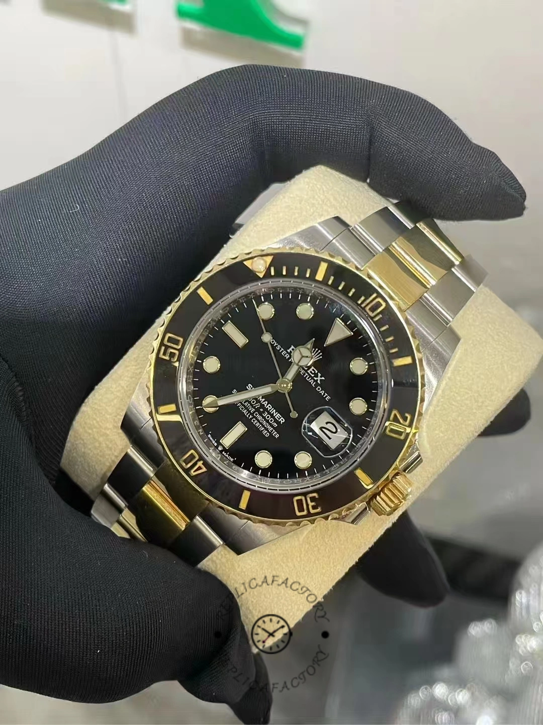 Angled view of a two-year-old Rolex Submariner 126613LN-0002 highlighting the dial, bezel, and date window
