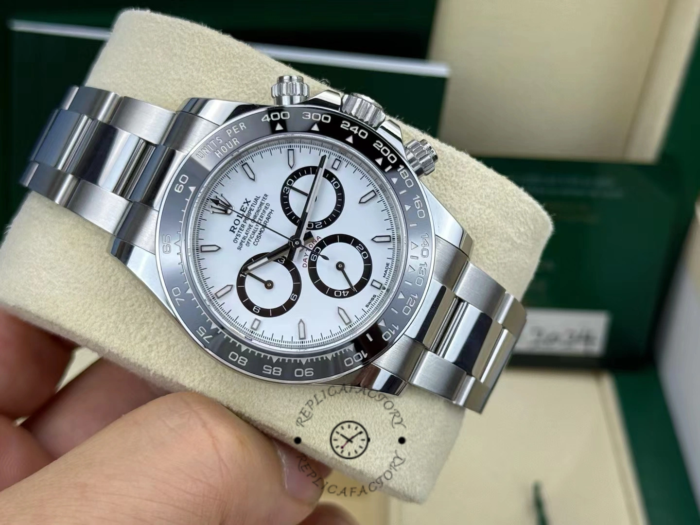 Front angled view of the Rolex Cosmograph Daytona 116500LN showing the white dial and black ceramic bezel under natural lighting