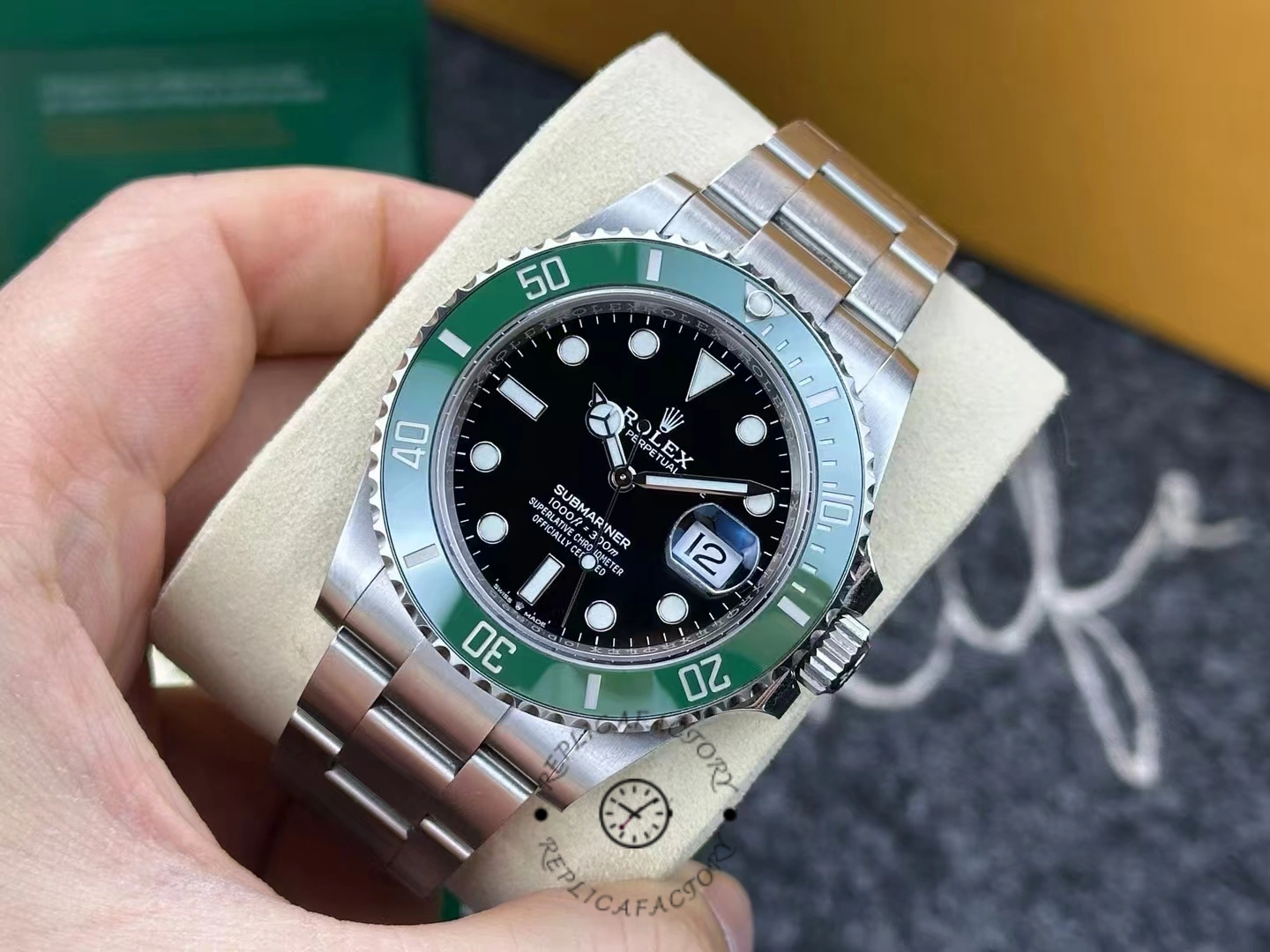 Rolex Submariner 126610LV worn for 3 years, green bezel and black dial close-up.