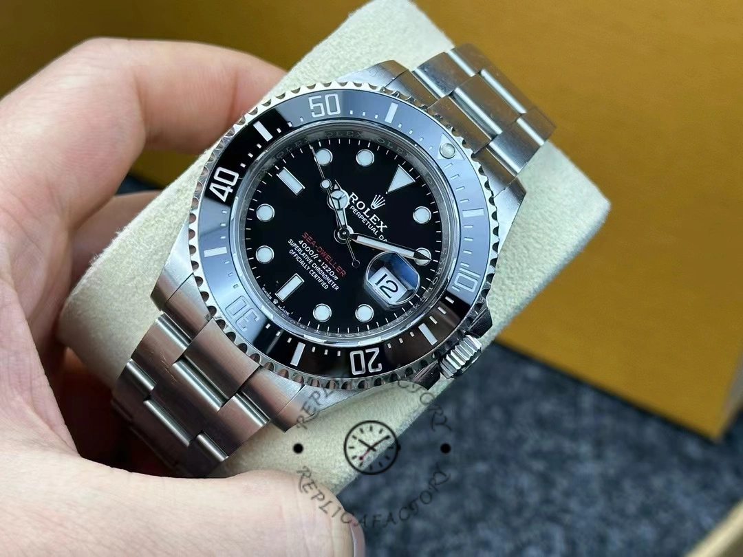 Angled view of Rolex Sea-Dweller 126600-0002 highlighting polished steel bracelet and red Sea-Dweller text.