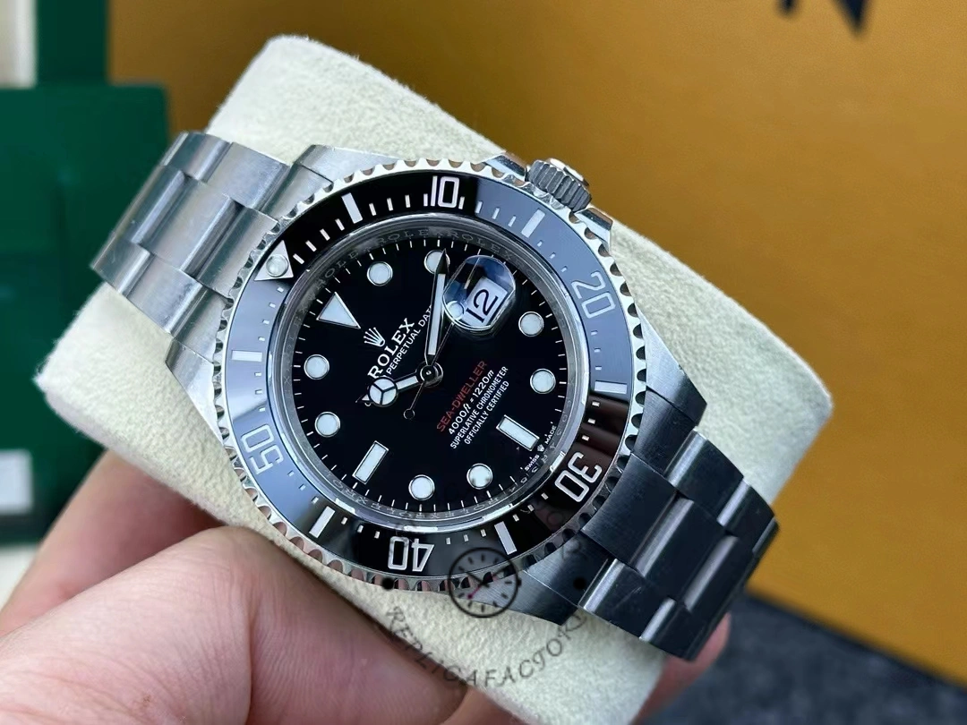Rolex Sea-Dweller 126600-0002 resting on cushion showing clean black dial and 43mm case.