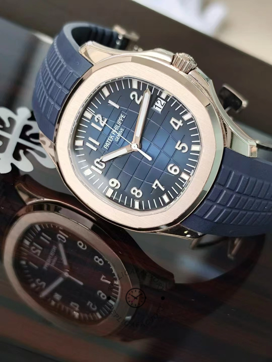 Side-angled view of the Patek Philippe Aquanaut 5164G-001 highlighting the polished bezel and crown.