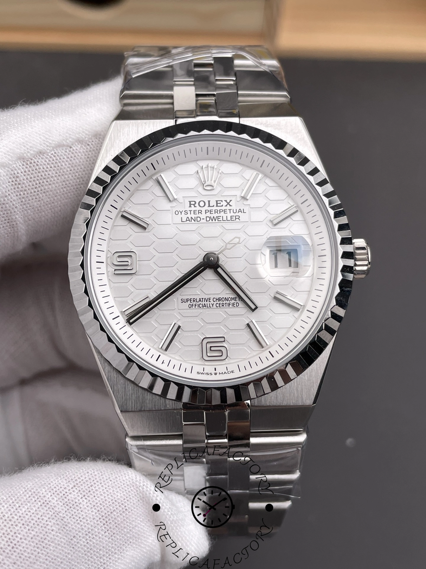 Close-up front shot of Rolex Land-Dweller 40 M127334-0001 Replica with white dial and cyclops date window.