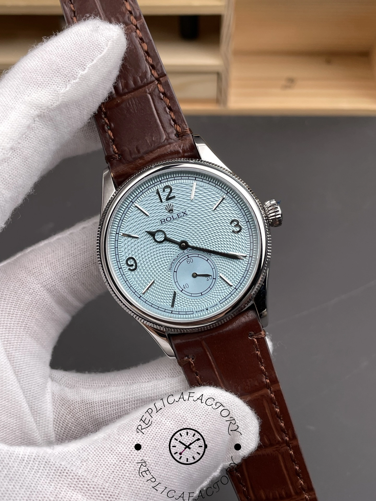 Angled hand-held view of the Rolex 1908 52506-0002 highlighting the slim case profile.