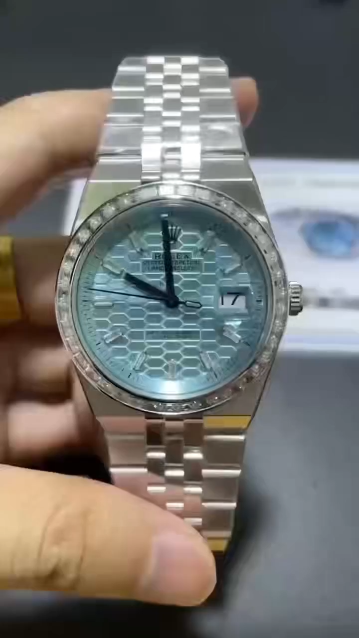 Video of Rolex Land-Dweller 40 127386TBR-0001 Replica showing diamond bezel sparkle and ice blue dial.
