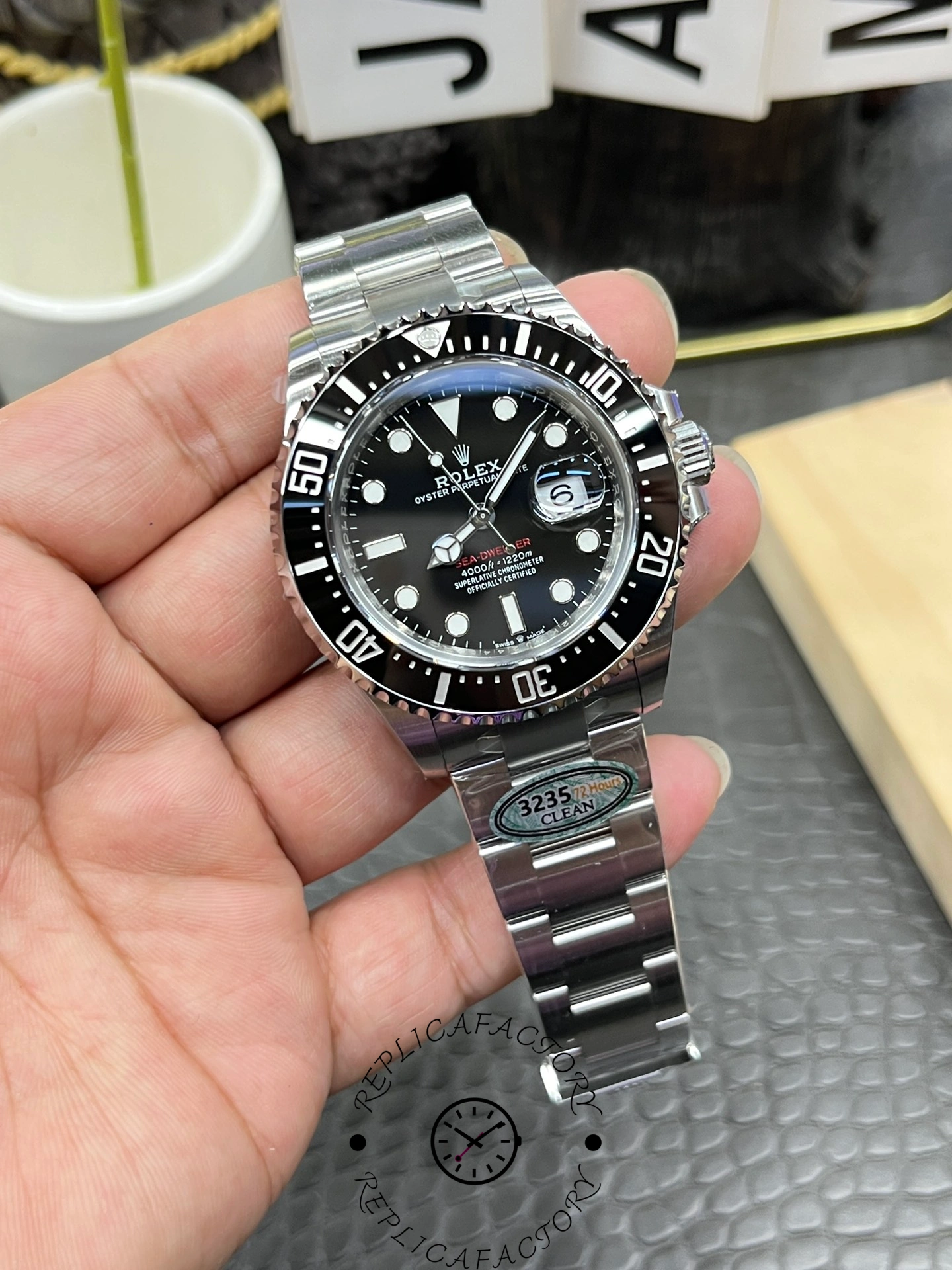 Rolex Sea-Dweller 126600 0002 close front view, black dial, black bezel, Oyster bracelet.