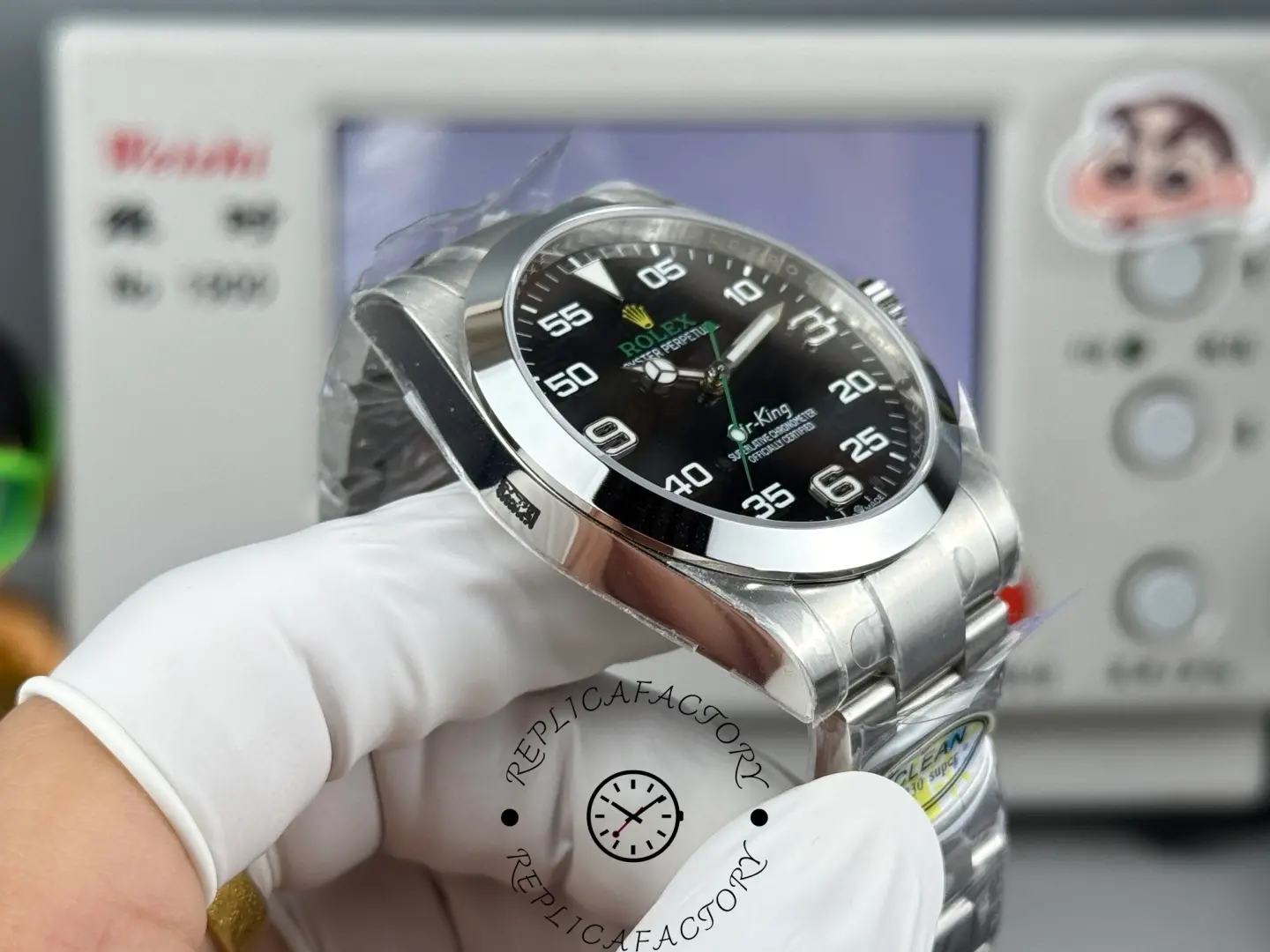 Rolex Air-King 126900 0001, side angle in hand showing case thickness and bracelet fit.